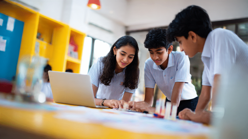 Indian school students collaborating on innovation projects during Viksit Bharat Buildathon 2025, showcasing prototypes, laptops, and charts with themes of Atmanirbhar Bharat and Vocal for Local